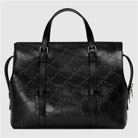 black embossed gucci bag|Gucci embossed leather tote bag.